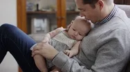 Close Up Slow Motion Shot Of Proud Father Kissing Baby Daughter On Lap / Provo, Stock Footage