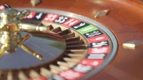 Close-Up Slow-Motion Shot of a Roulette Wheel at an Outdoor Event Stock Footage 316561402