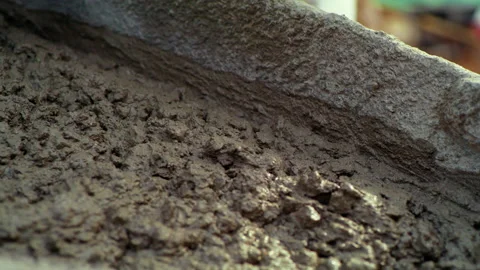 Close-Up Slow Motion Shot Of Wet Concrete Sliding At Construction Site - Little Stock Footage 204037972
