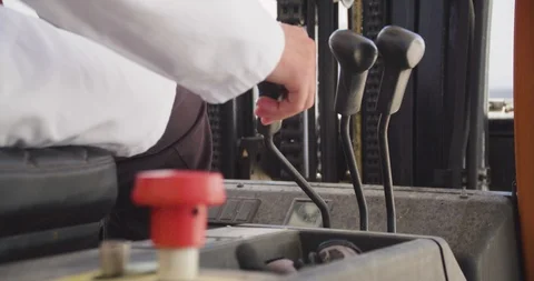 Close up slow motion shot, young man hand drive, operate forklift, 4K. Stock Footage 117191231