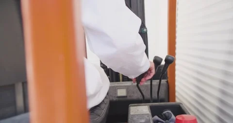 Close up slow motion shot, young man hand drive, operate forklift. Stock Footage 117191988