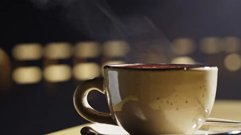 Close-up slow motion of a steaming cup of coffee Video stock 220767790