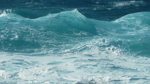 Close-up slow motion storm sea waves with turquoise water glowing in sunlight Stock Footage 332482966