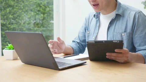 Close up slow motion tracking shot : business man talking in video conference Stock Footage 139357882