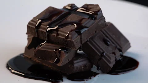 Close up slow - motion turn around the stacked chocolate topped with chocola Видео 136210230