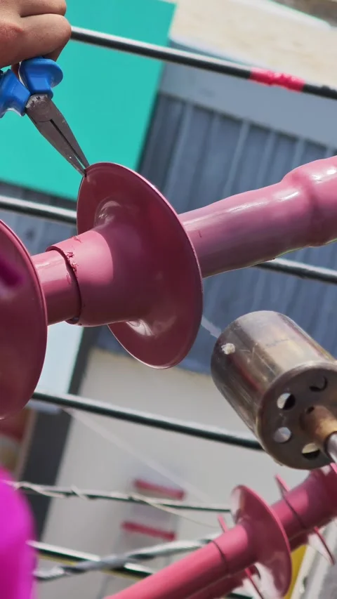 Close up slow motion video of a lineman using a heat torch to shrink . 스톡 동영상 340277990