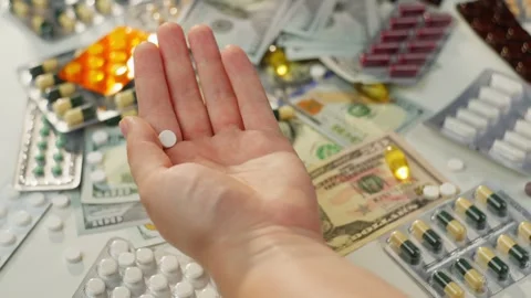 Close-up slow motion video of spilling antibiotic pills into hand. Stock Footage 279563899