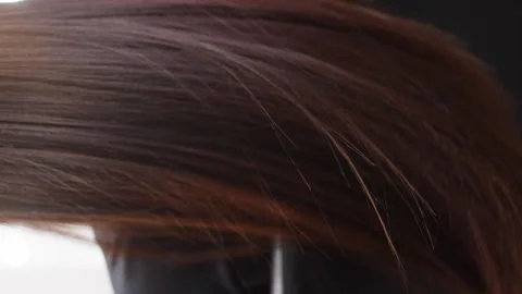 Close-up slow motion video of womans hair moving. Stock Footage 313234969