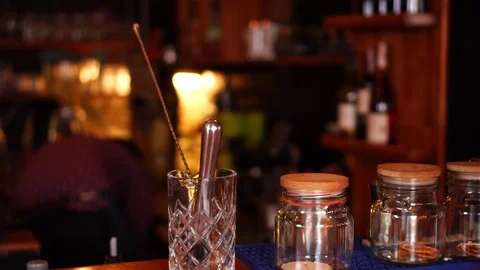 Close up slow motion view on bartending instruments and jars filled with spices Stock Footage 104373437