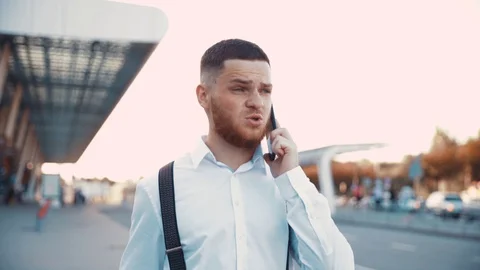 Close up slow motion view of brutal bearded handsome man walking down the street Stock Footage 115669035