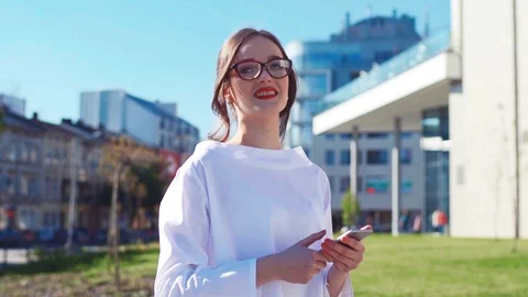 Close up slow motion view of young attractive woman in elegant blouse with Stock Footage 107396419