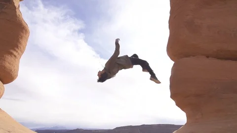Close Up Slow Motion Wall Flip on Natural Stone Arch Stock Footage 98858283