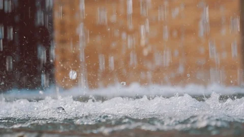 Close-up slow motion of water drops making splashes in fountain Stock Footage 97203806