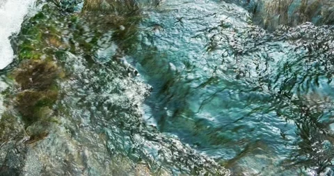 Close up slow motion water flow in a creek. Stock Footage 151847762
