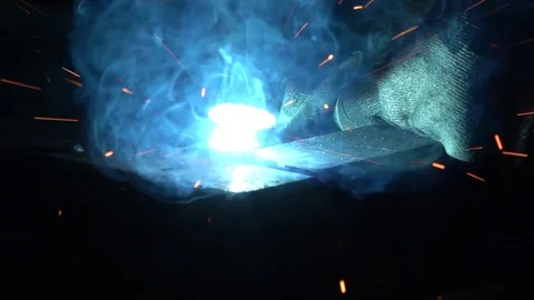 Close up slow motion welding details, many hot sparks and light flashes. Stock Footage 123364581