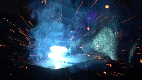 Close up slow motion welding details, many hot sparks and light flashes. Stock Footage 123364616