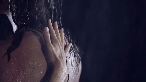 Close-up. slow motion. woman's hand glides along the wet back is another girl Vídeos de archivo 77765414