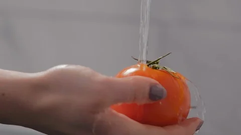 Close-up, Slow Motion, Woman's Hand Washes Tomato Stock Footage 103635936