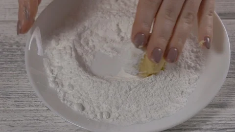 Close-up, Slow Motion, Woman's Hands Roll A Ball of Dough for Baking Icing Sugar Stock Footage 102633054