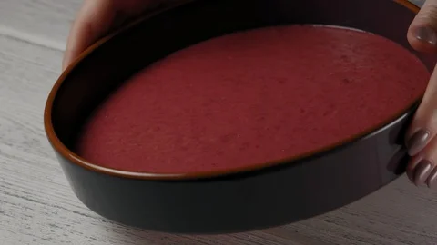Close-Up, Slow Motion, Woman's Hands Bowing to the Plate with Fruit Smoothie Stock Footage 103488920