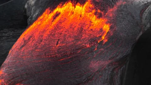 Close up slow moving red hot volcanic lava making an environmental wilderness. Stock Footage 160029032
