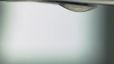 A close up of slowly dripping tap. Drops of water. Stock Footage 129710494