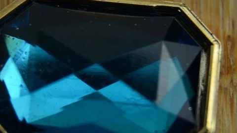 Close-up of slowly rotating blue diamond 스톡 동영상 107578212