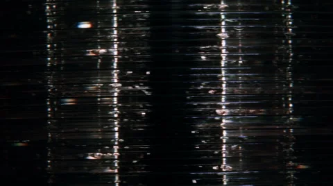 Close up of slowly rotating DVDs with spectral colors Stock Footage 58801694