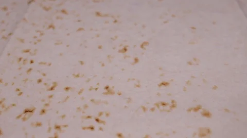 Close up of slowly rotating thin layer of pita bread Stock Footage 106807353