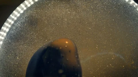 Close up, Slowmo, Fine glitters seems to twinkle like falling stars inside Stock Footage 115509111