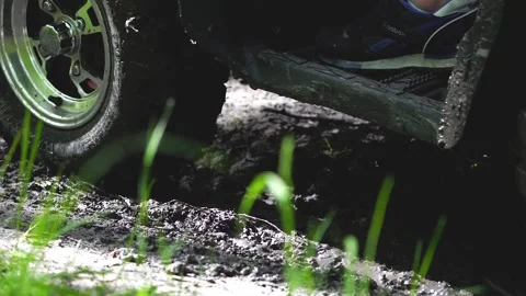 Close up. Slowmotion. Dirt from the wheels of the ATV. Stock Footage 139884375