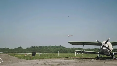 Close up of small airplane Flies close to the ground Stock Footage 76630249