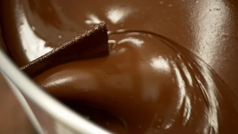 Close-up of small-batch, hand-crafted chocolate blending in large bowl. Stock Footage 100645212