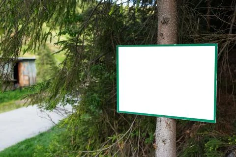 Close-up of small billboard with empty mockup in the woods. Stock Photos
