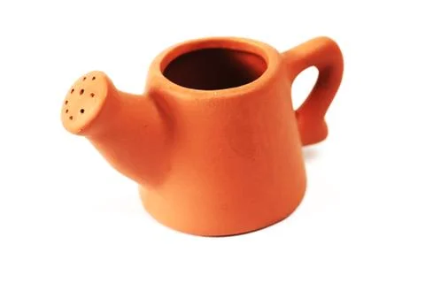 Close-up of small ceramic watering can Stock Photos