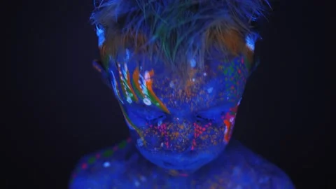 Close-up of a small child's face with an ultraviolet pattern on the face. Stock Footage 130236305