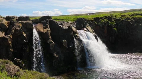 Close up of a small clear, pure, Icelandic waterfall Stock Footage 59882742