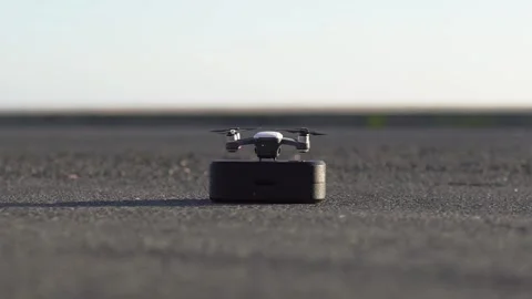 Close-up of small commercial drone taking off in city street Stock Footage 133260361