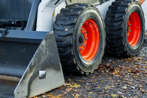 Close-up of small construction loader showing steel bucket attachment Stock Photos