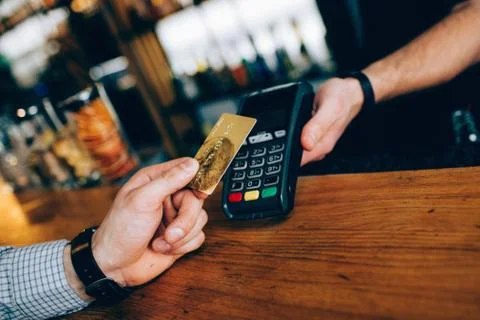 Close up of small device that uses for payments. You can use any type of card to 写真素材