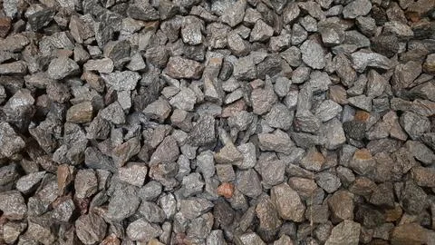 Close-up of small gray and brown gravel rocks texture background Фото