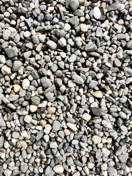 Close-up of small gray pebbles, showcasing texture Stock Photos