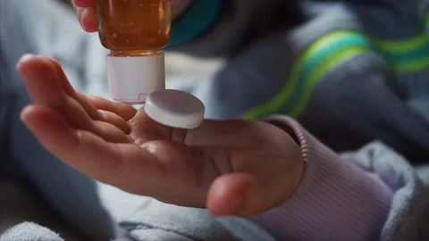 Close up. Small kids hands squeeze out some antiseptic on palm for disinfecting Stock Footage 130420011