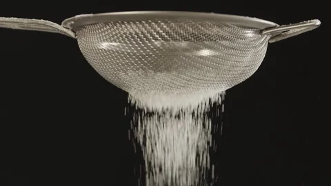 Close-up of a small metal sieve through which flour is sifted Stock Footage 152551355