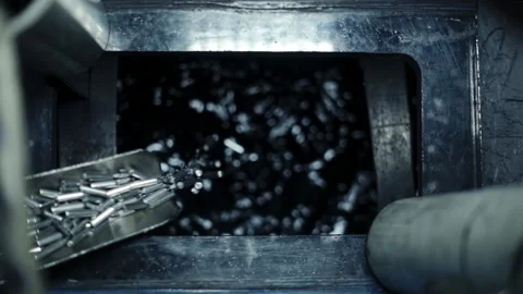 Close Up Of Small Metal Tubes Fall In A Water Hatch In Steel Production Process Stock Footage 210232362