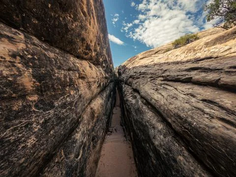 Close up of small narrow passage with steps between stones in canyonlands nat Stock Photos