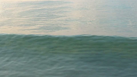 Close Up Of Small Ocean Waves Moving Towards Shore in Rolling Motion Stock Footage 120331783