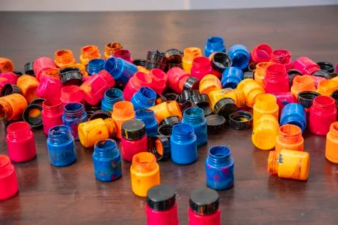 Close up of small paint containers on floor Stock Photos
