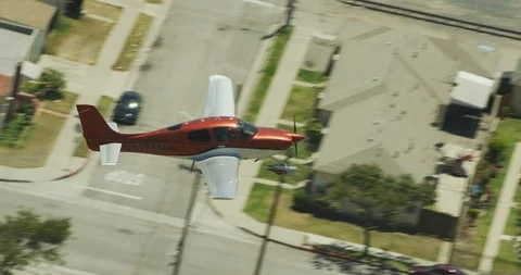 Close up of small plane over suburbs, drone, helicopter aerial Stock-Footage 106383354