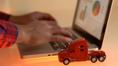 Close-up Of A Small red Toy truck On Laptop Keypad Video stock 101285751